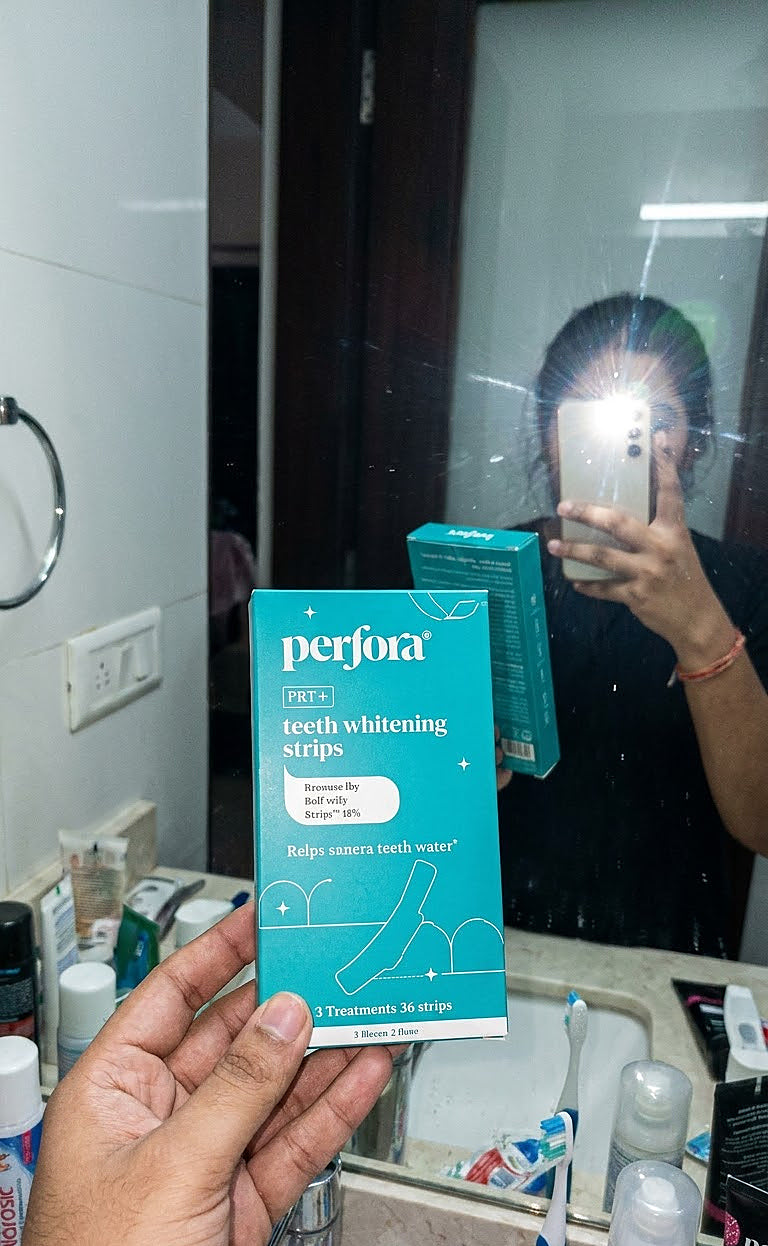 Varun Das holding Teeth Whitening Strips (Classic Mint)