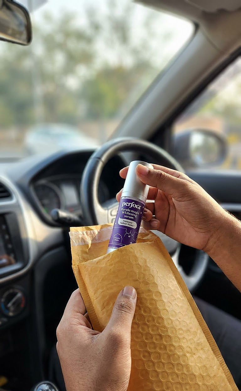 Anjali Bhatt holding Purple Teeth Whitening Serum