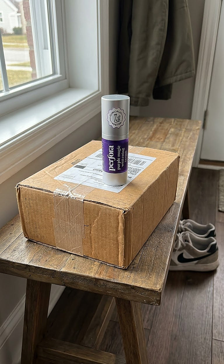 Ayesha Khan holding Purple Whitening Toothpaste Serum