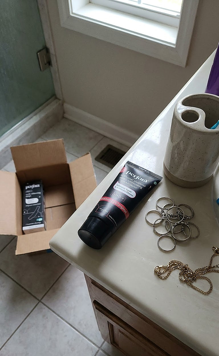Harsh Vardhan holding Perfora Purple Magic Whitening Toothpaste