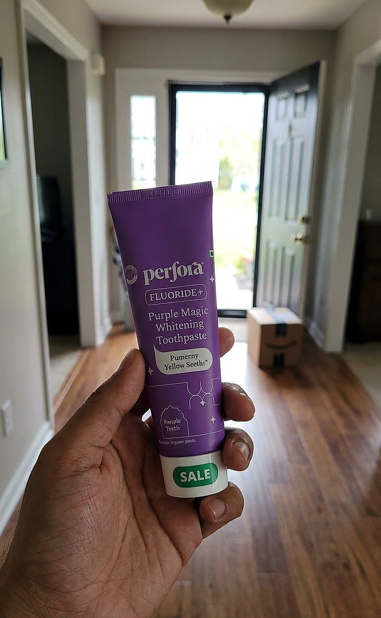 Ishita Reddy holding Perfora Purple Magic Whitening Toothpaste
