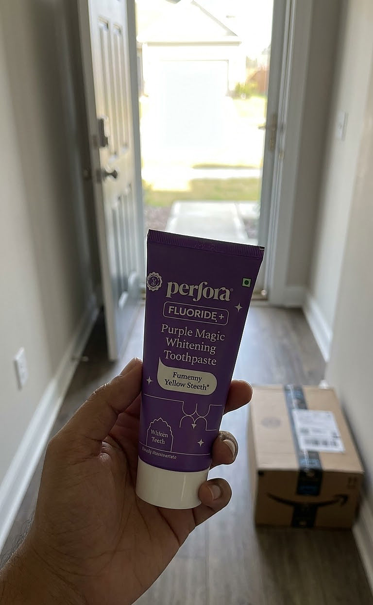 Aditya Nair holding Perfora Purple Magic Whitening Toothpaste